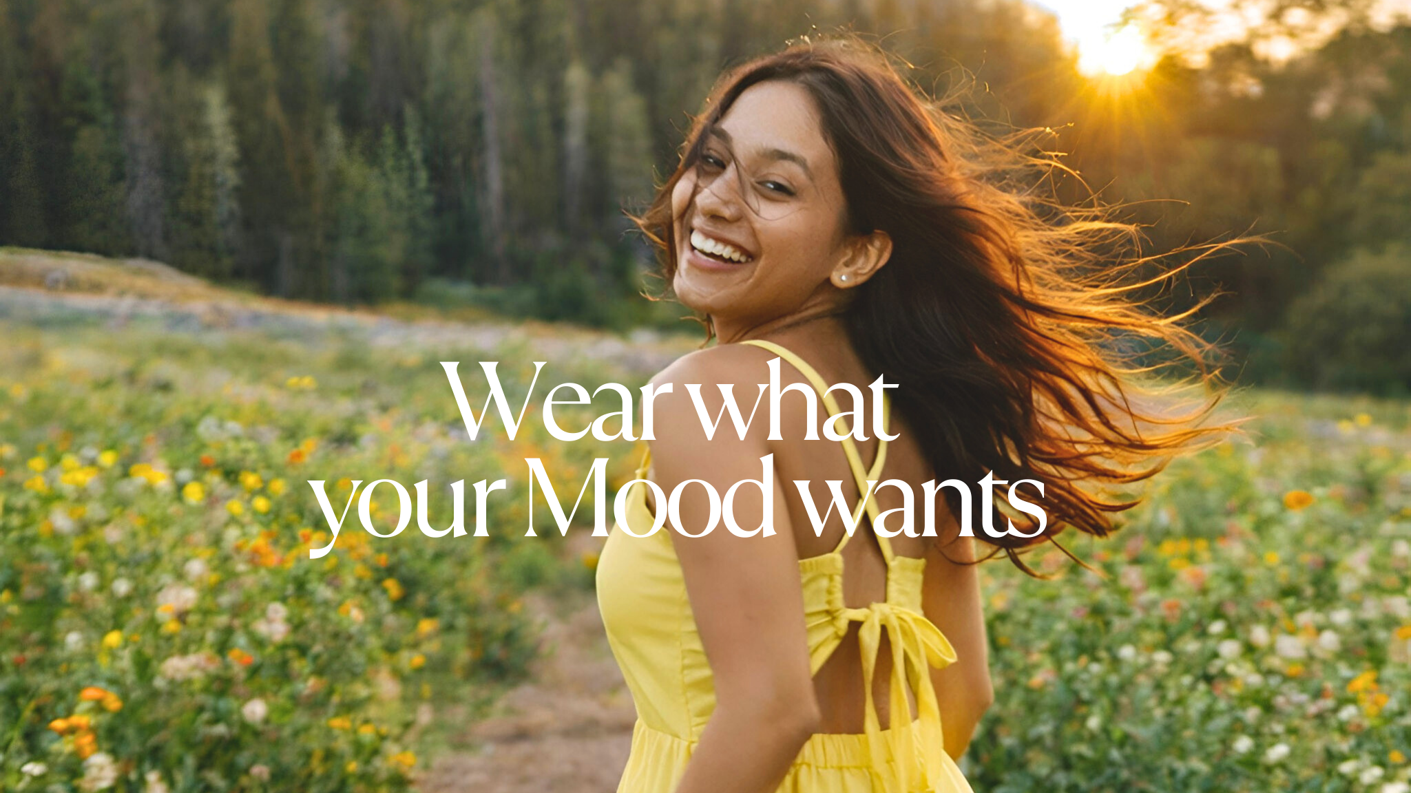 Woman in a yellow dress standing in a field with text overlay 'Wear what your Mood wants'.