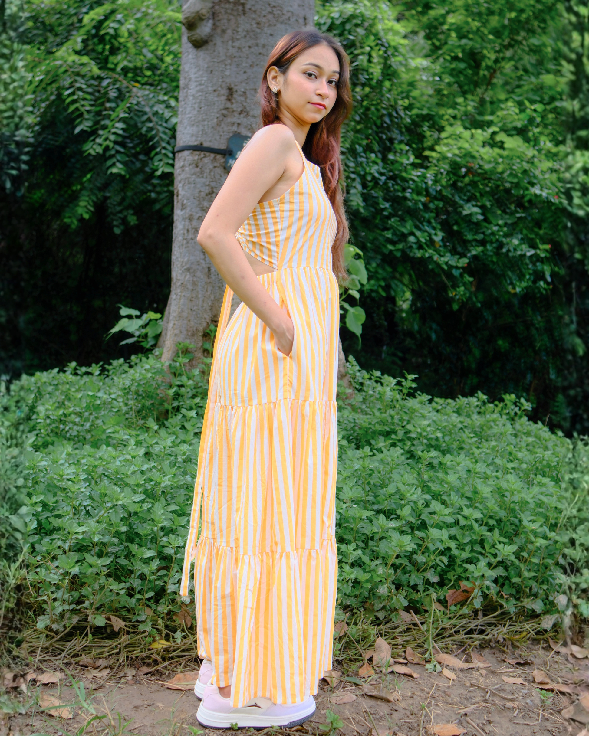 women in a pure cotton sleeveless maxi dress which has pockets and back tie details from Moodora 