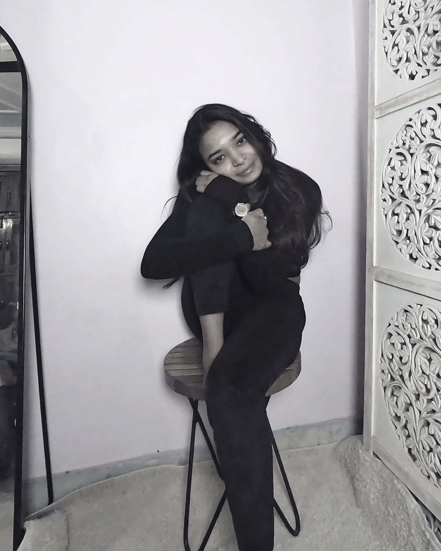 moodora's founder sitting in her room with peace and confidence in her eyes. 