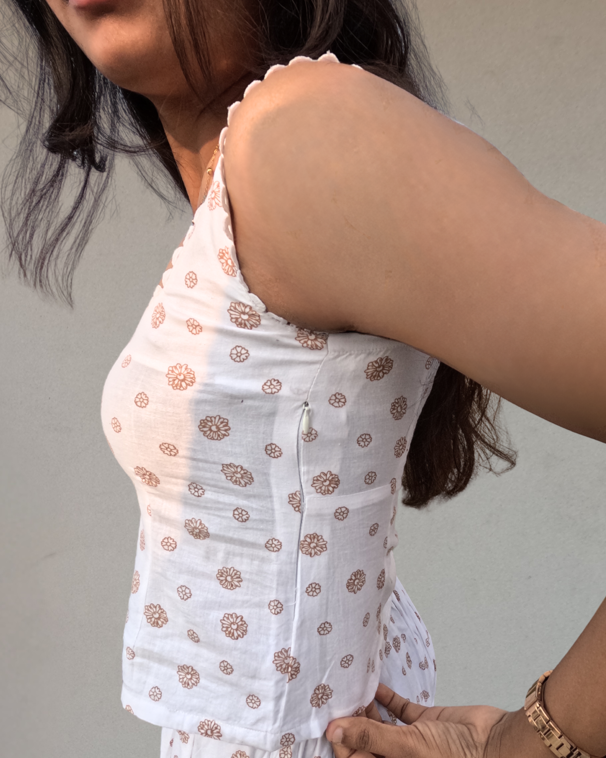 women wearing a white pure cotton everyday wear Top by moodora showing the side zipper which gives a better fit.